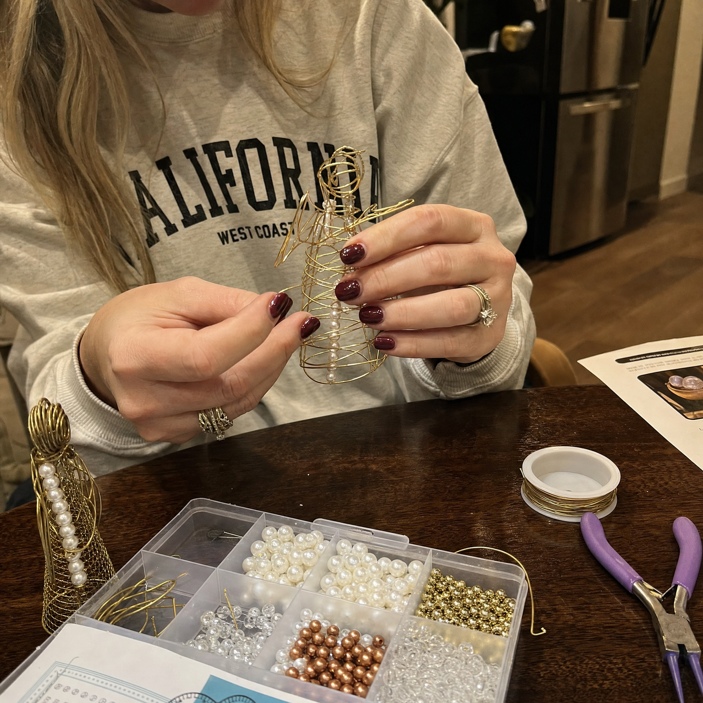 Customer review: hands crafting a bead figurine